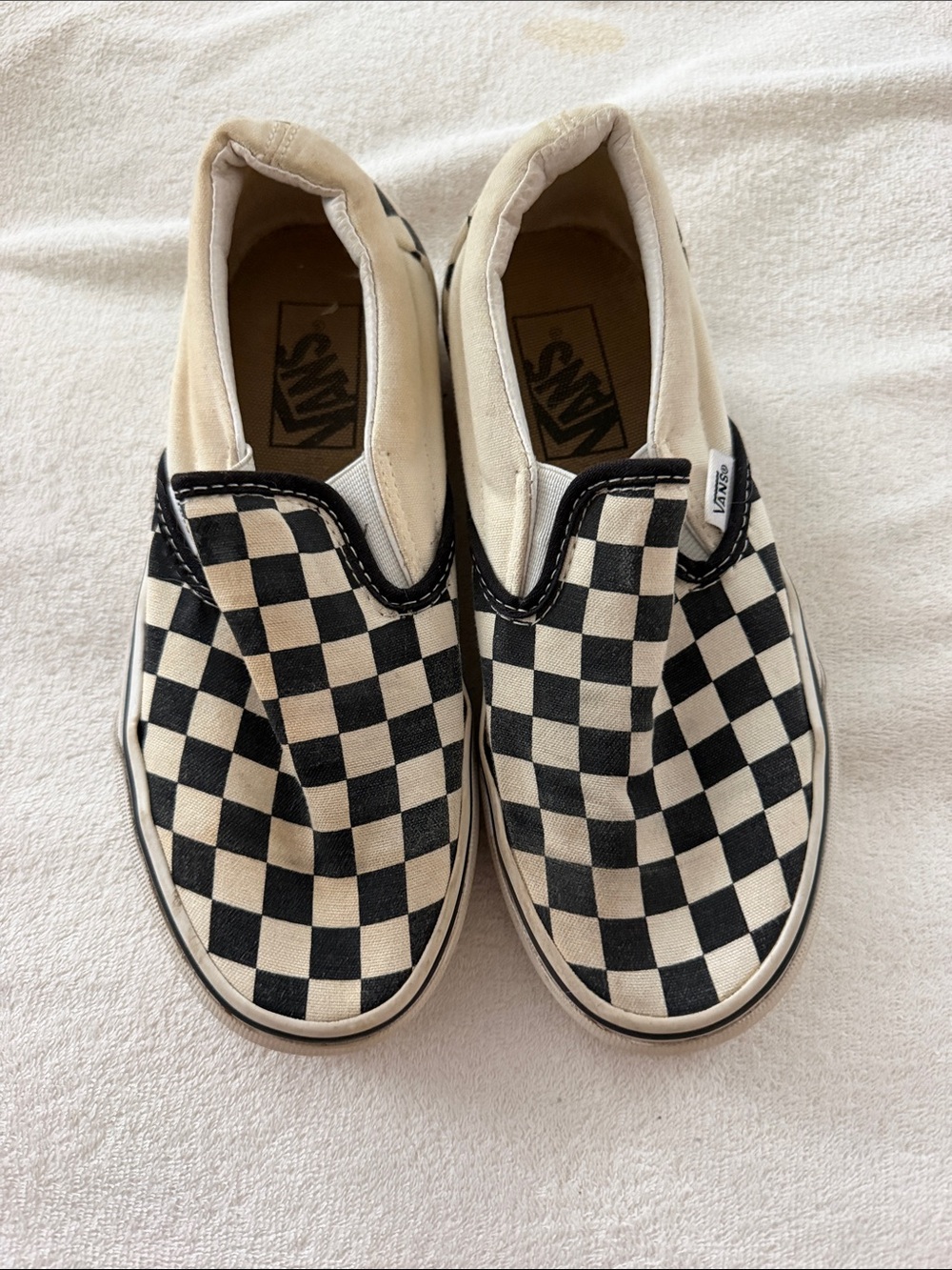 Vans Slip-On Checkerboard Sneakers in Black and white